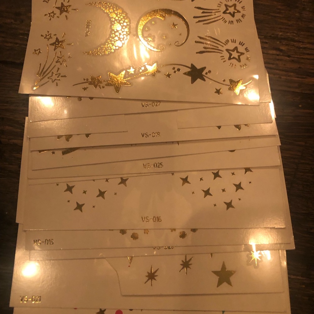 Gold face/body temporary tattoos plus